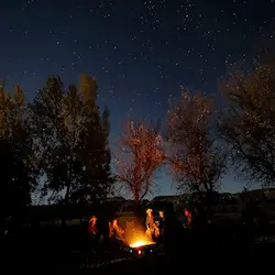 Around the campfire, stories are shared